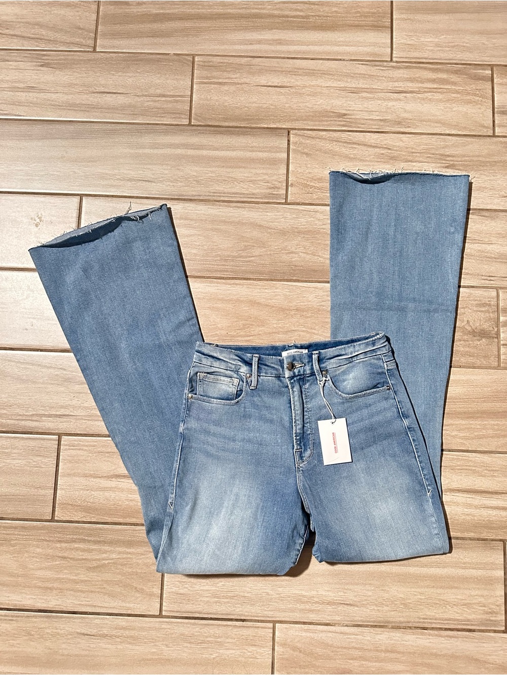 Good American Light Blue Flare Jeans with Raw Hem